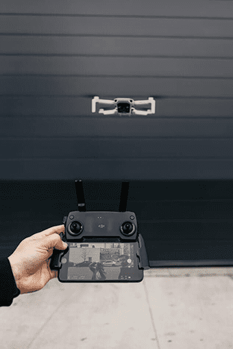 Hand Holding a DJI Controller